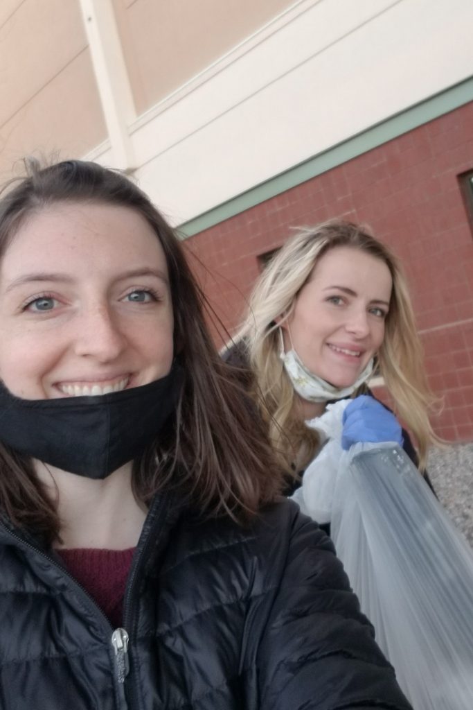 Photo of Samantha Shinaberger and Audrey Phillips cleaning up trash